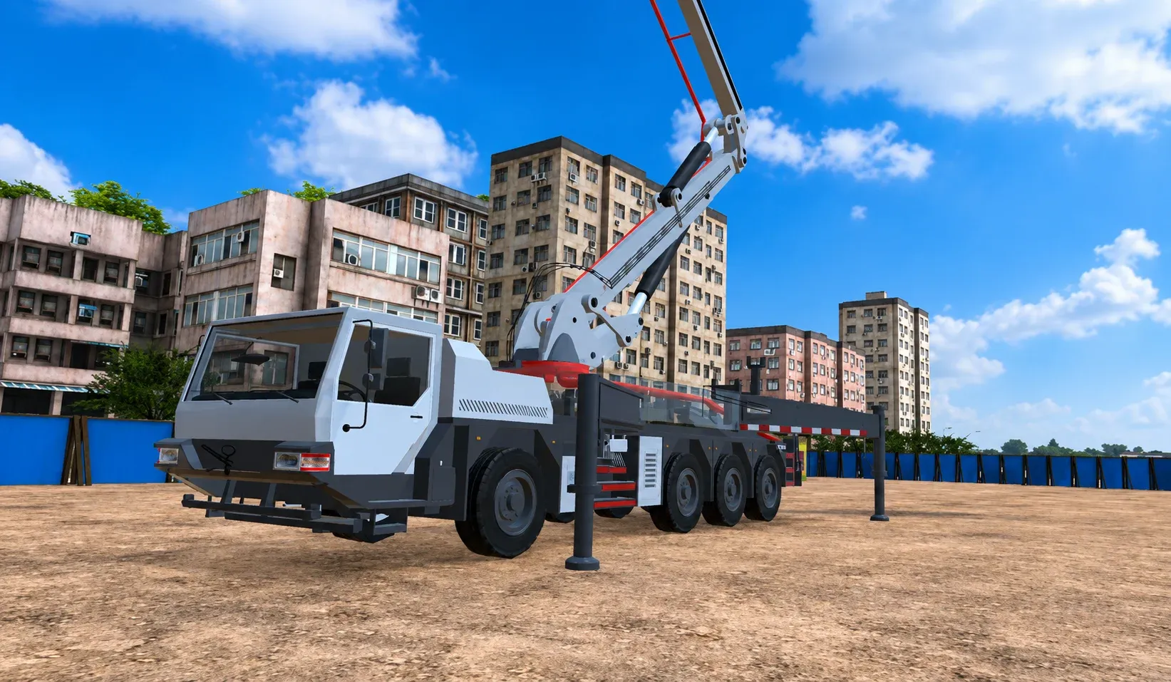 Concrete placer boom truck parked on a site with the boom folded for transport